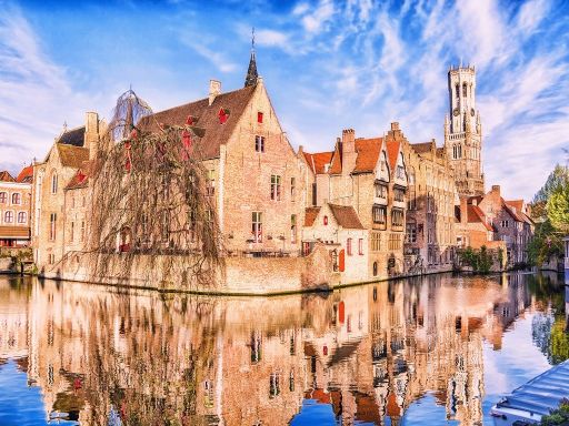 tower Belfort and houses in medieval fairytale town Bruges